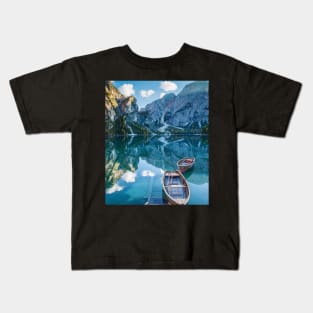 Calm boats in a lake through the mountains Kids T-Shirt